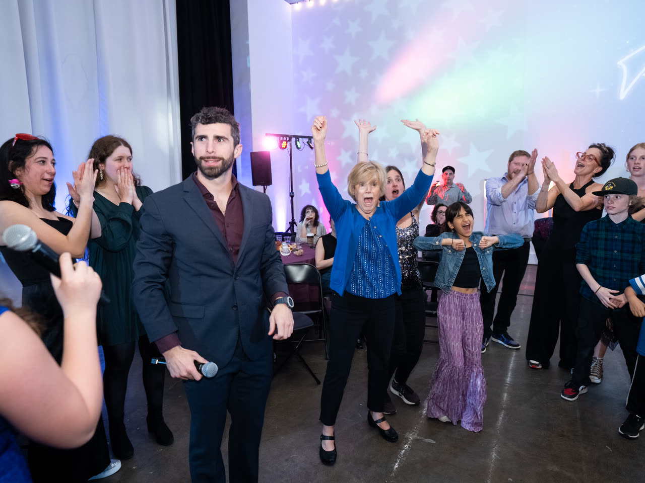 A full dance floor with guests of every age at a bar or bat mitzvah reception