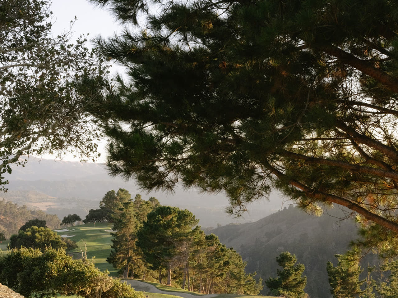 A golden-hour view over the hills from a mountain venue